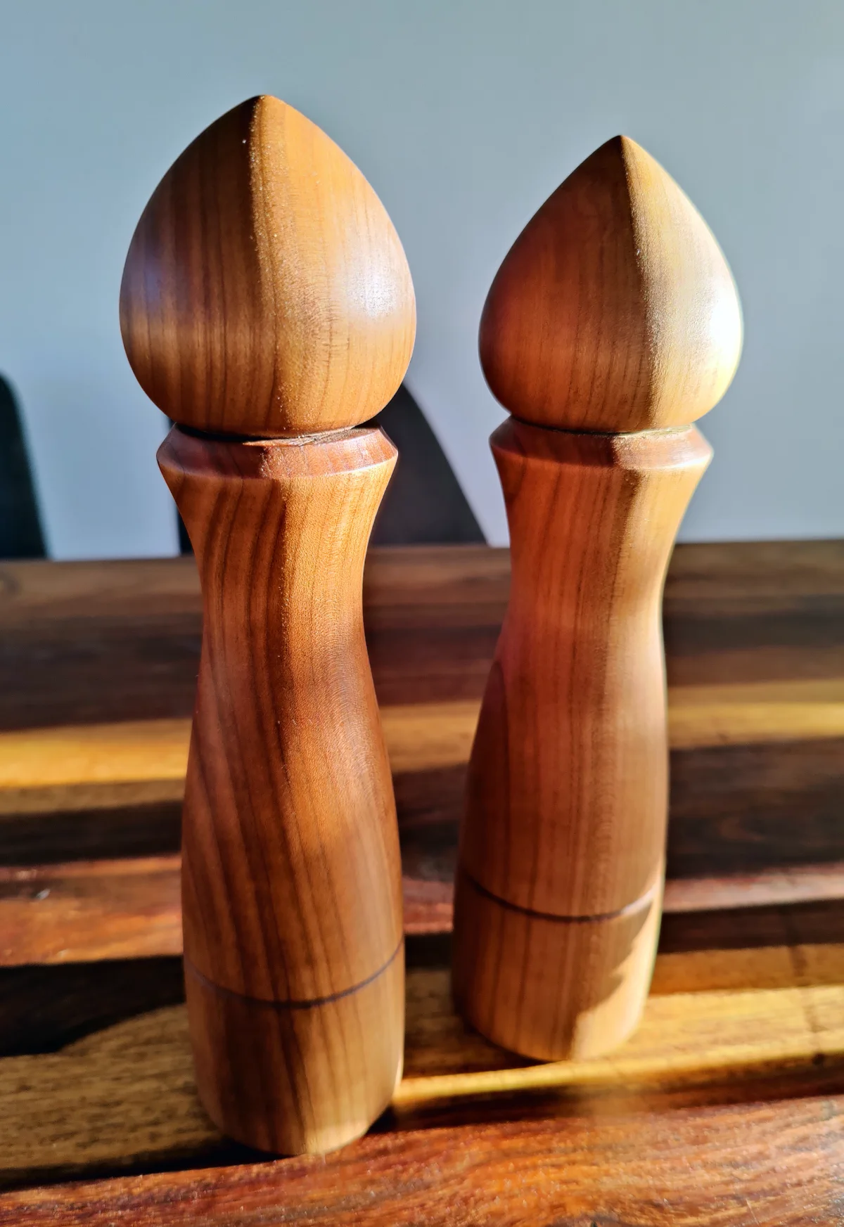 2 pepper grinders made from smoked cherry wood