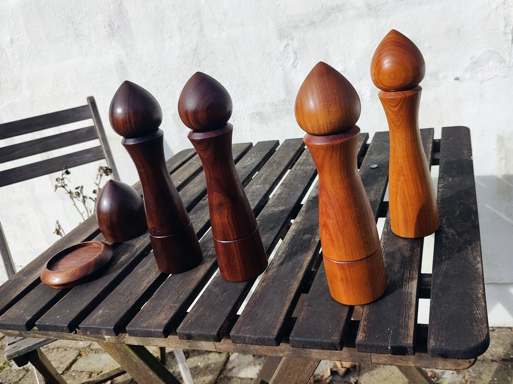 Pepper grinders and a raffle cup on a small cafe table