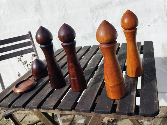 Pepper grinders and a raffle cup on a small cafe table
