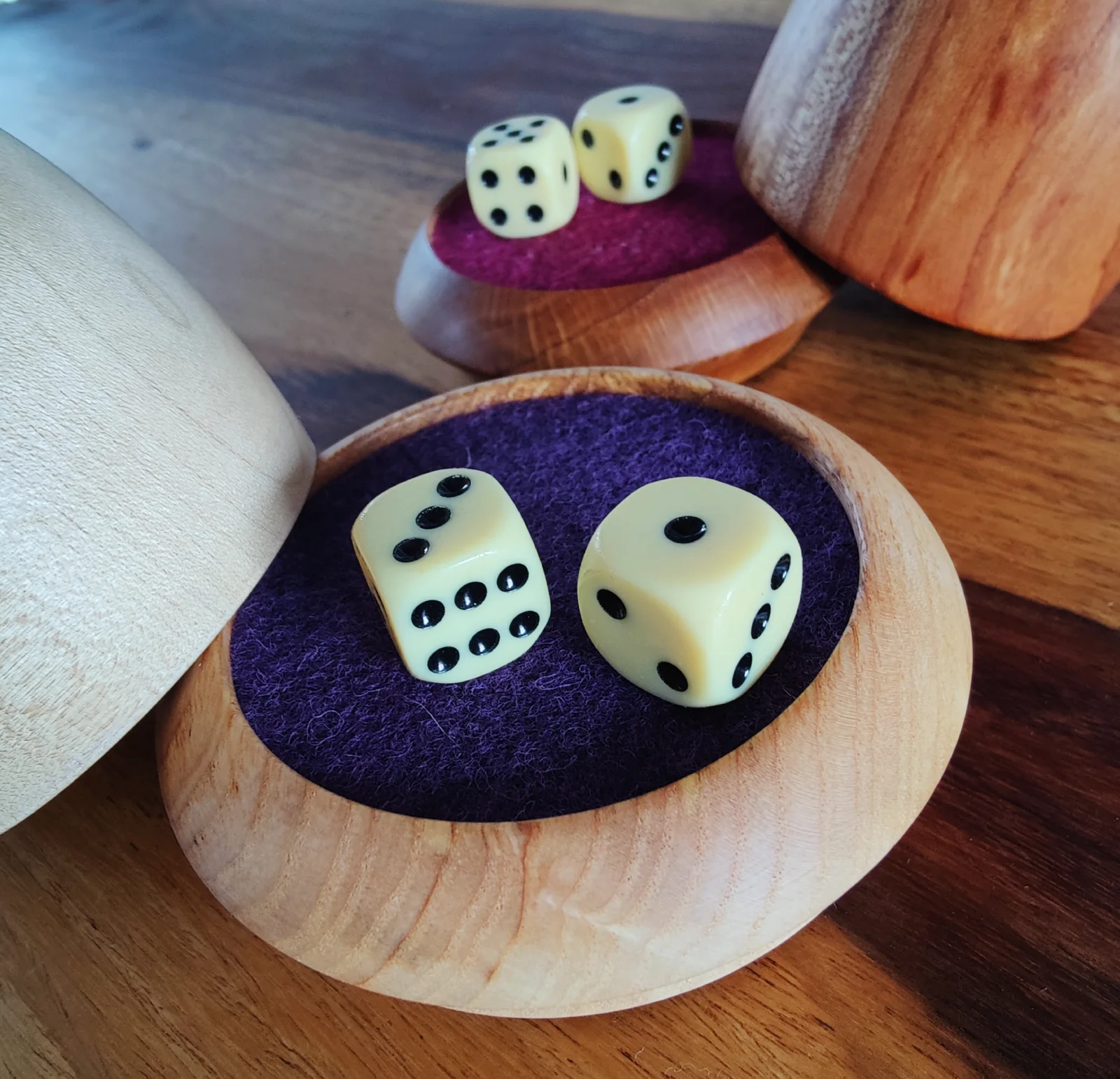 Raffle cup with purple felt and dice
