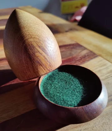 raffle cup. the lid is leaning on the base